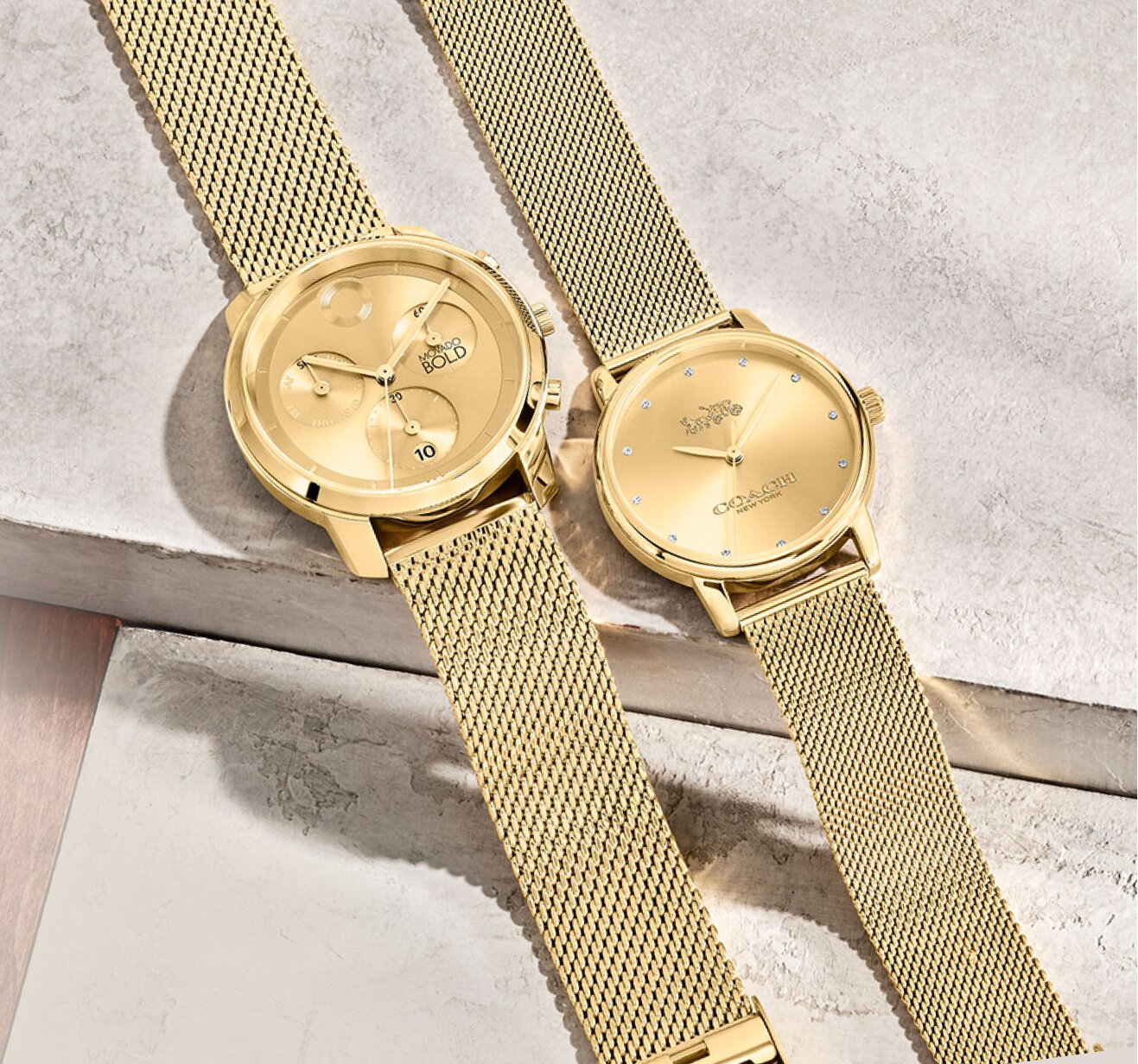 Picture of gold Movado trend chronograph watch and gold coach grand watch with mesh bracelets