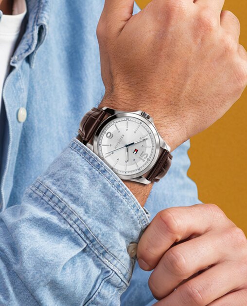 Tommy Hilfiger mens brown strap watch on model