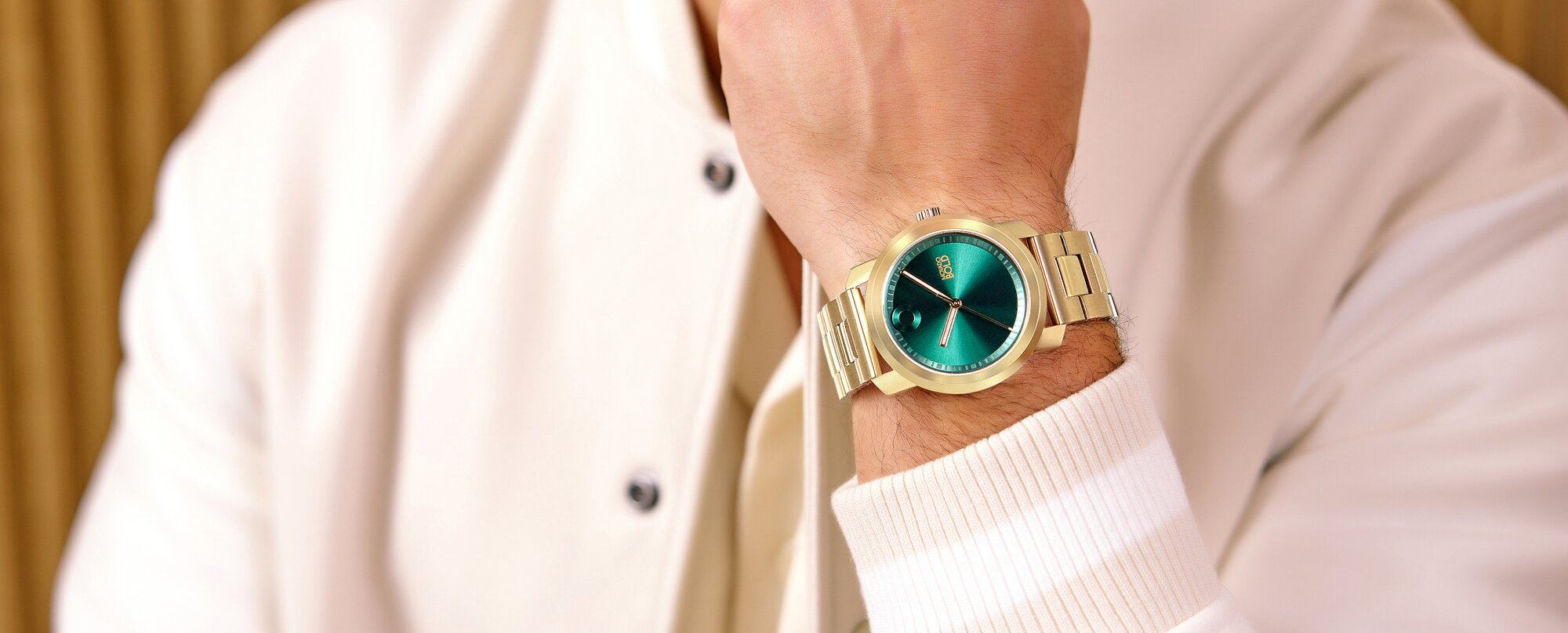 Model wearing movado trend propel watch with green dial on sale for $369
