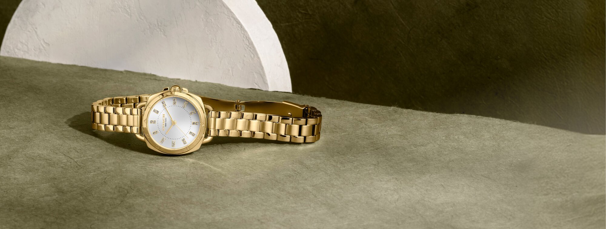 Coach Tatum gold plated bracelet with white dial and crystal markers