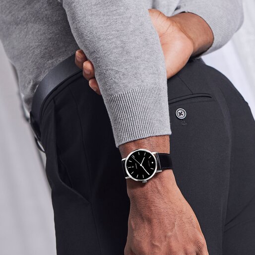 Movado Signature automatic watch on model with black strap, silver case and black dial 