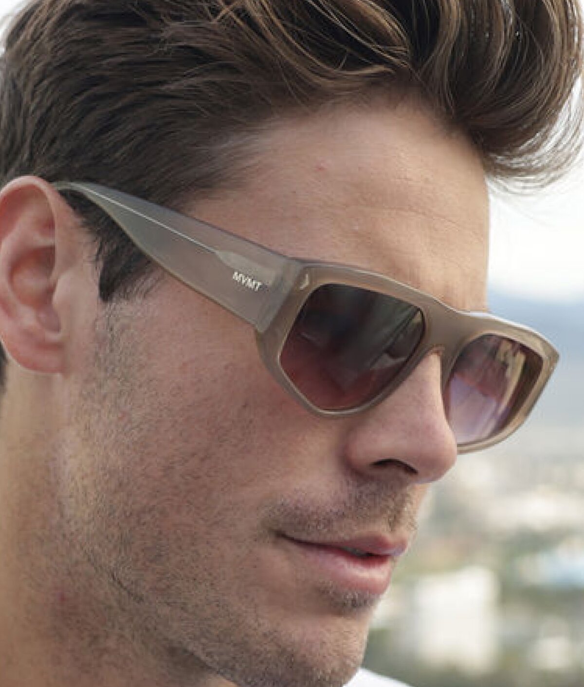Model wearing MVMT Racer sunglasses