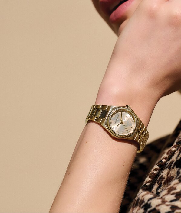 Olivia Burton Mini Hexa gold watch on model
