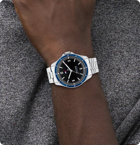 Tommy Hilfiger men's stainless steel bracelet with black dial on model