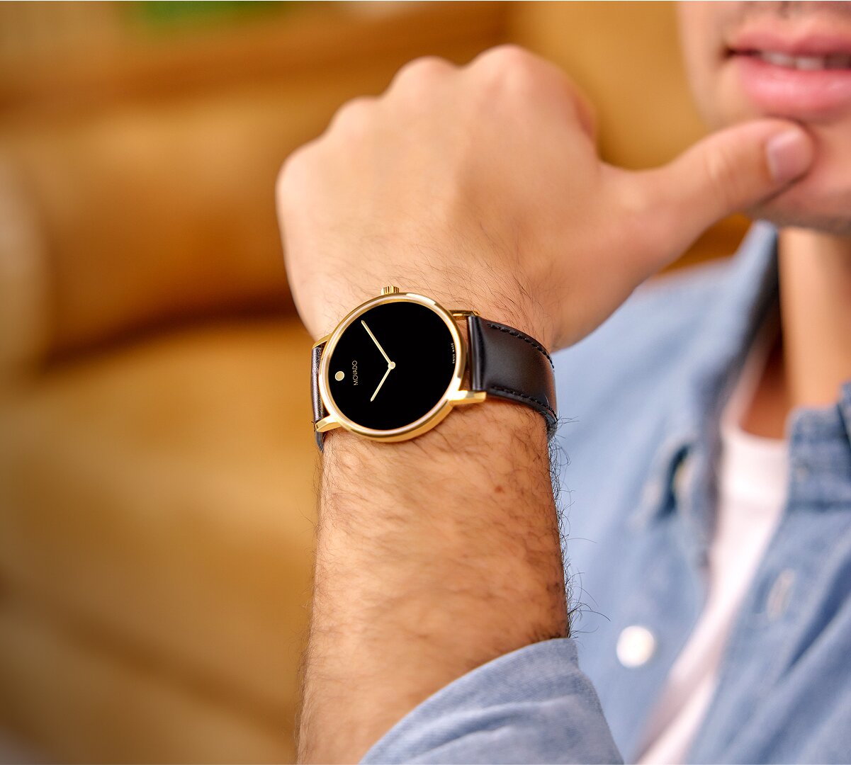 Model wearing the Movado Active Sport Chronograph watch alongside a close up detail of the watch with two tone bracelet and green dial