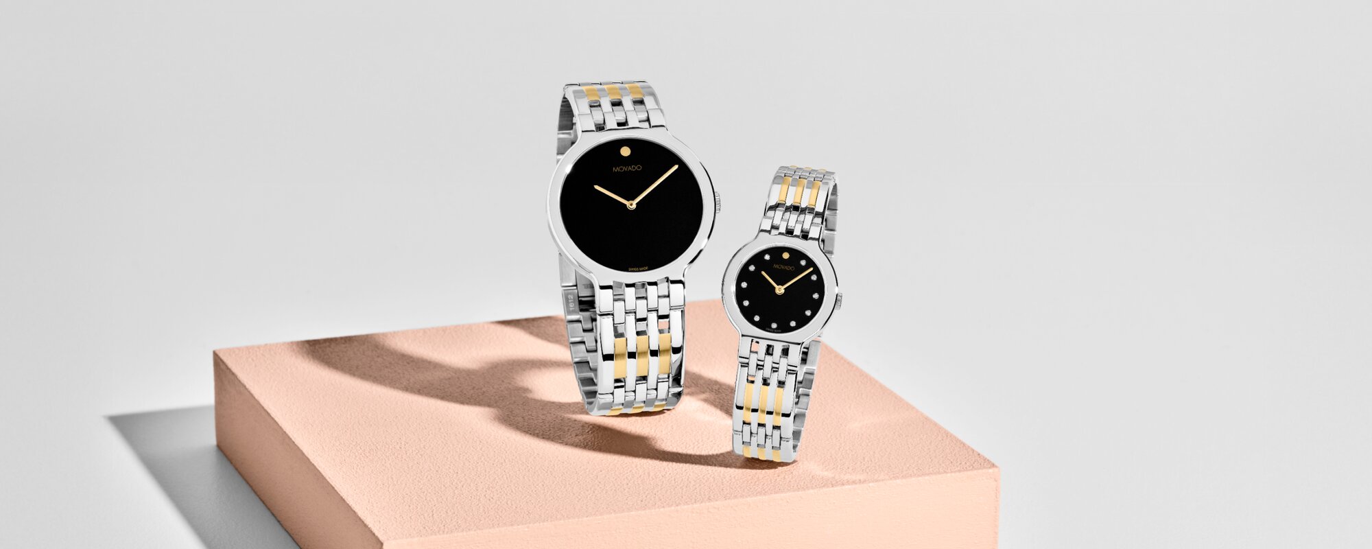 Movado two tone his and her Essence watches