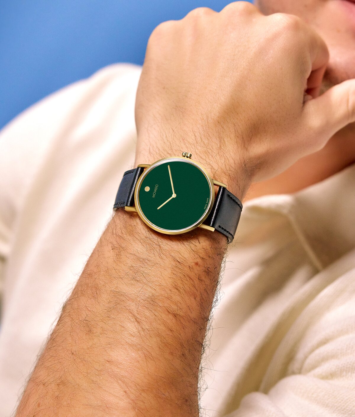 Model wearing movado signature watch with black strap and green dial on sale for $278