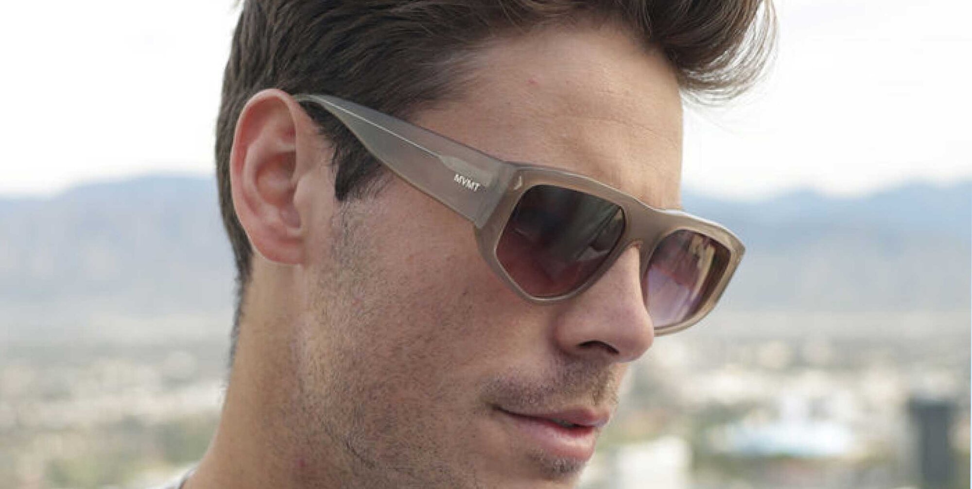 Model wearing MVMT Racer sunglasses
