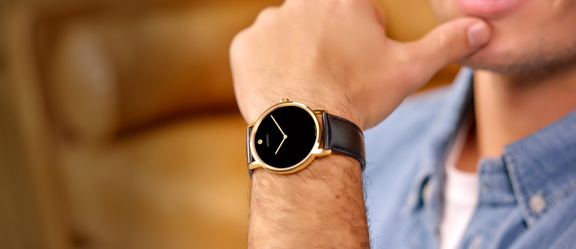 Model wearing the Movado Active Sport Chronograph watch alongside a close up detail of the watch with two tone bracelet and green dial