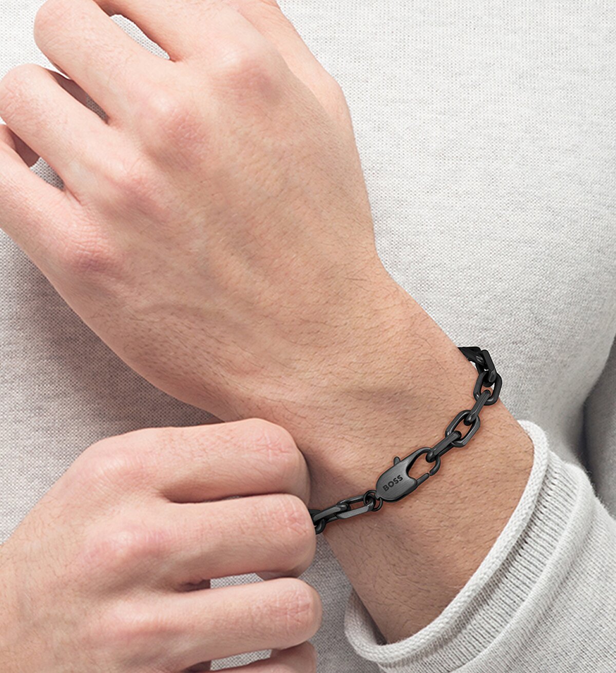 Model wearing men's Boss Kane bracelet composed of unique links