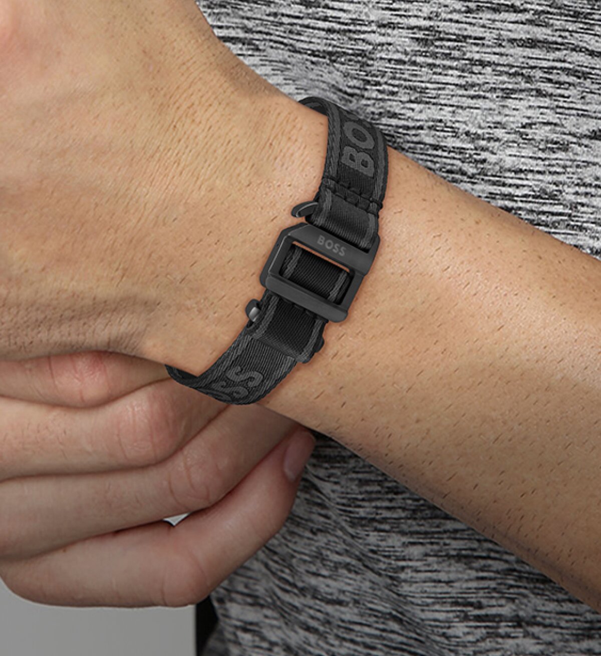 Model wearing Boss Colin bracelet in black
