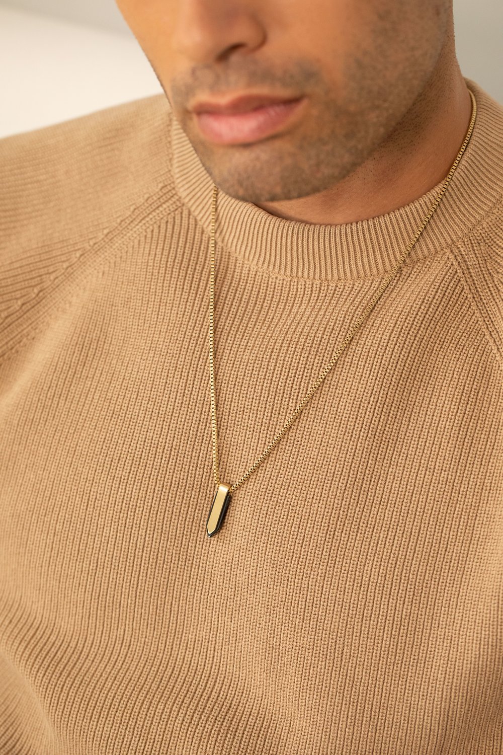 Movado micro tag necklaces on model