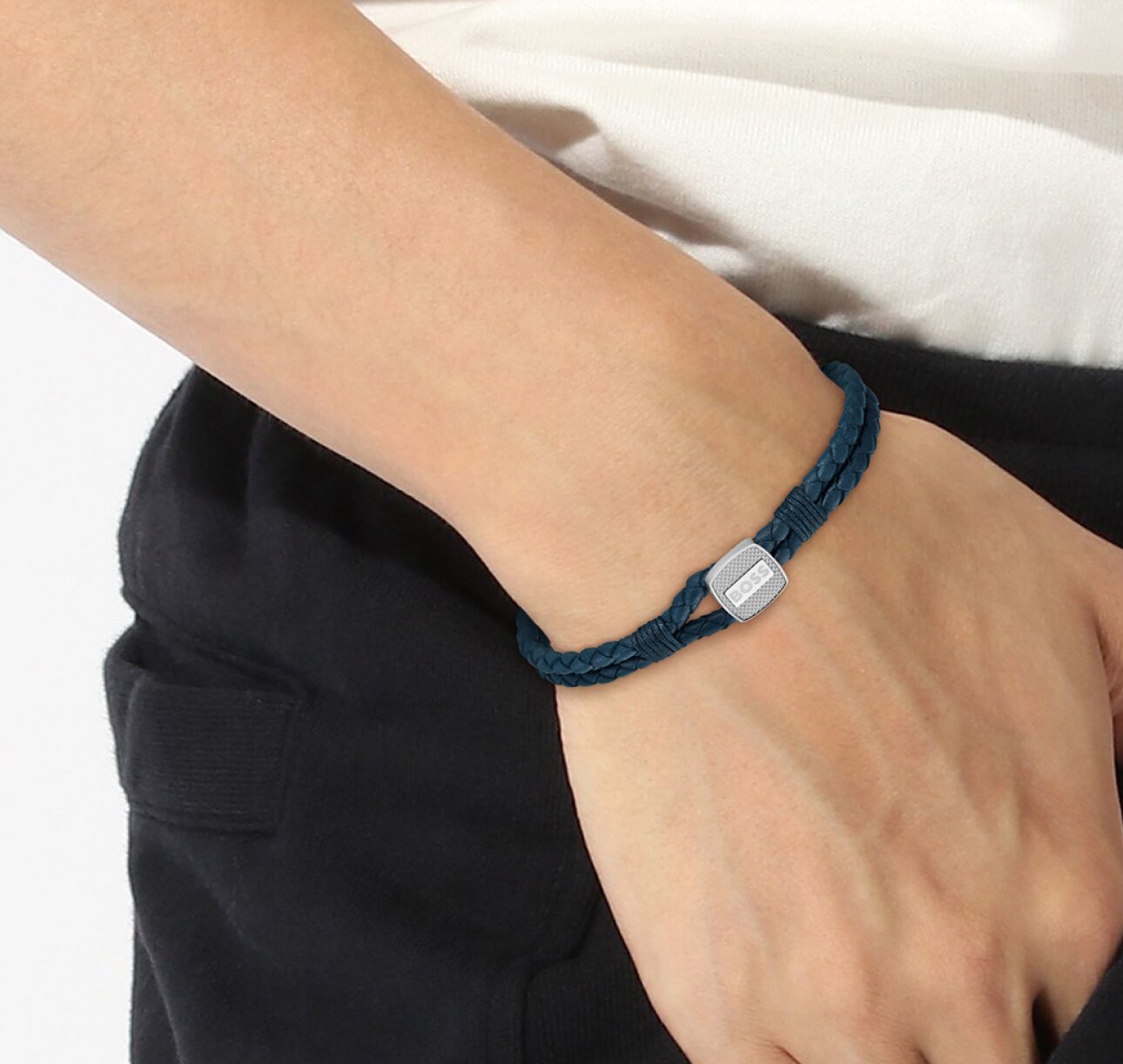 Model wearing men's Boss Seal bracelet with blue braided leather