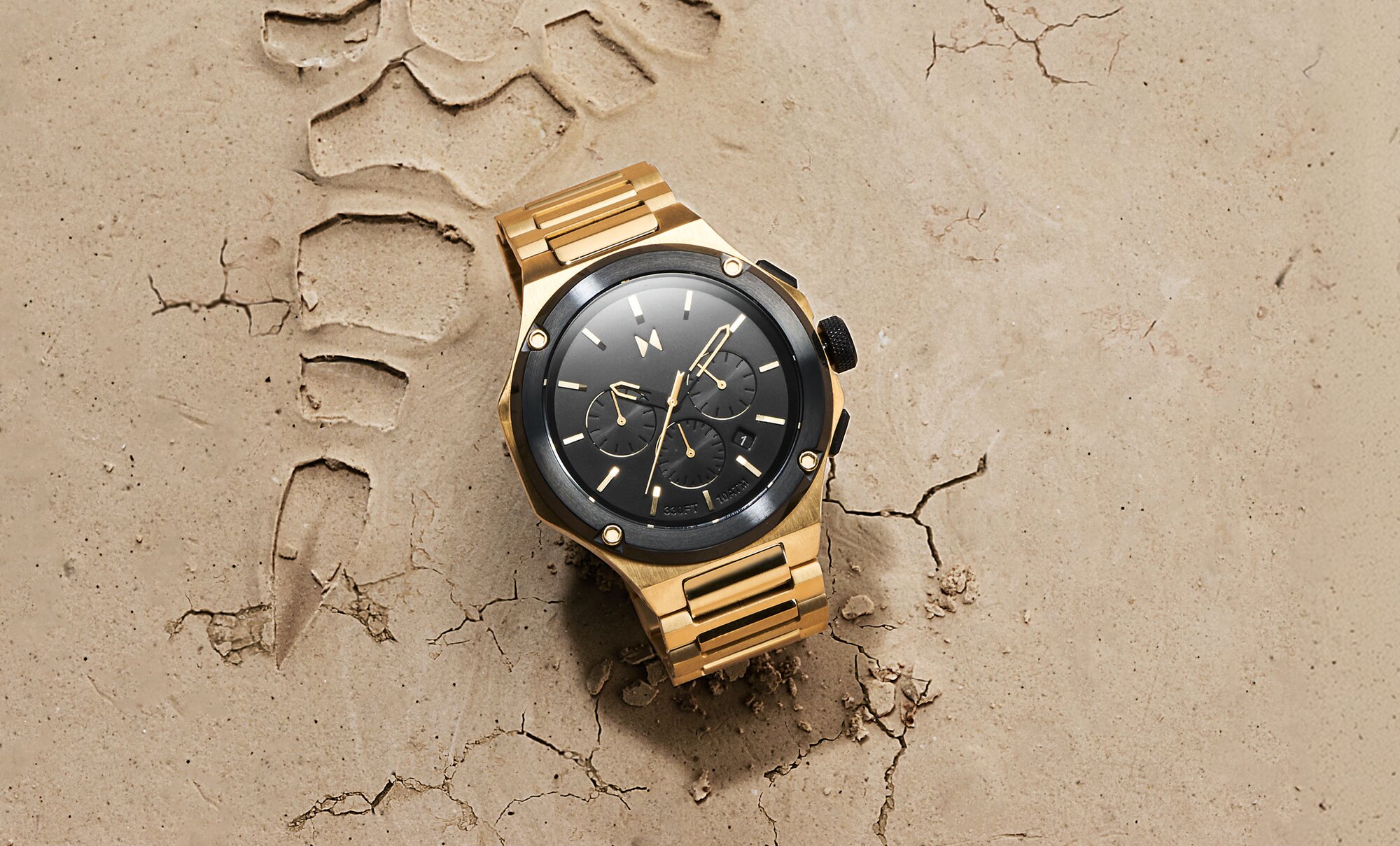 MVMT Raptor mens watch on sand