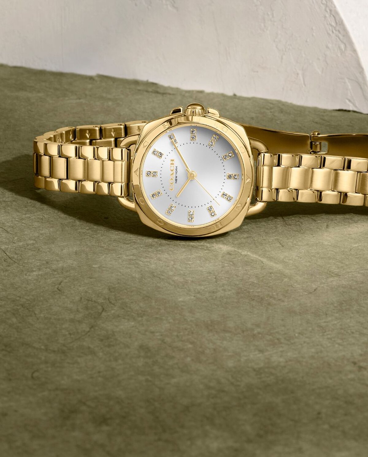 Coach Tatum gold plated bracelet with white dial and crystal markers
