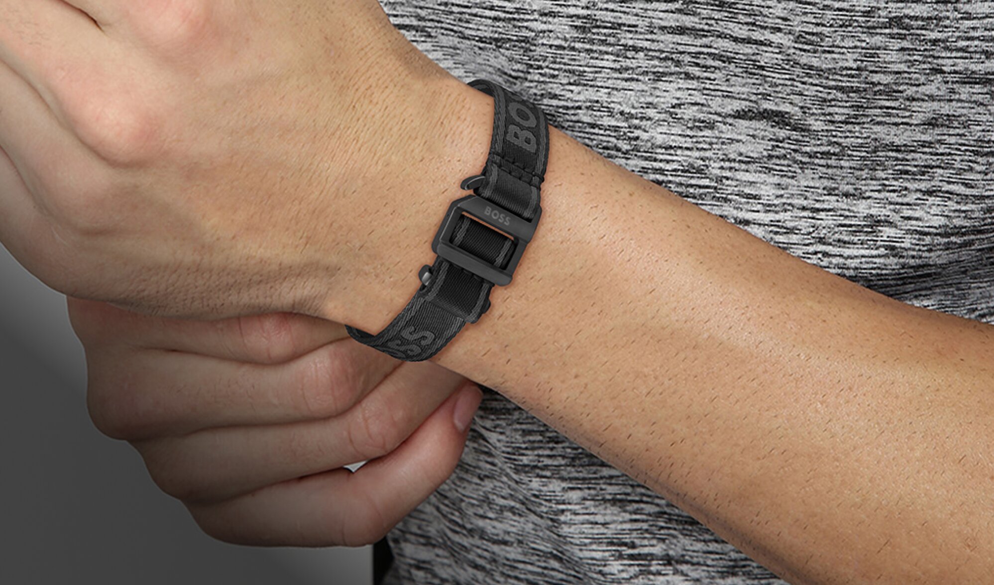 Model wearing Boss Colin bracelet in black