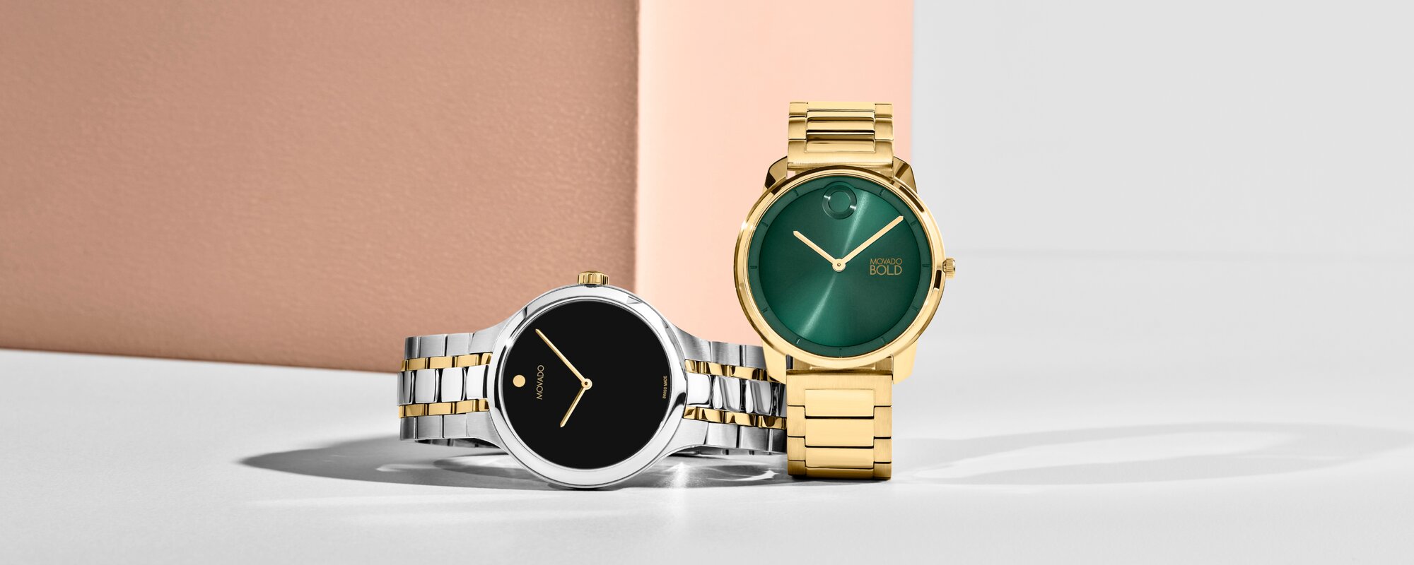 Movado Areo deal with two tone bracelet  and black dial paired with a Movado Trend Element deal with gold bracelet and green dial