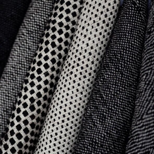 Spark Stories: Human Material Loop - 4 folded fabrics made from human hair, each with a different woven pattern