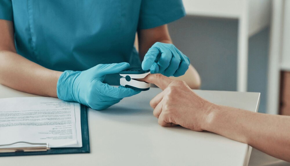 A nurse takes a patient's vital signs before using the SBAR nursing technique to provide a handoff to the physician
