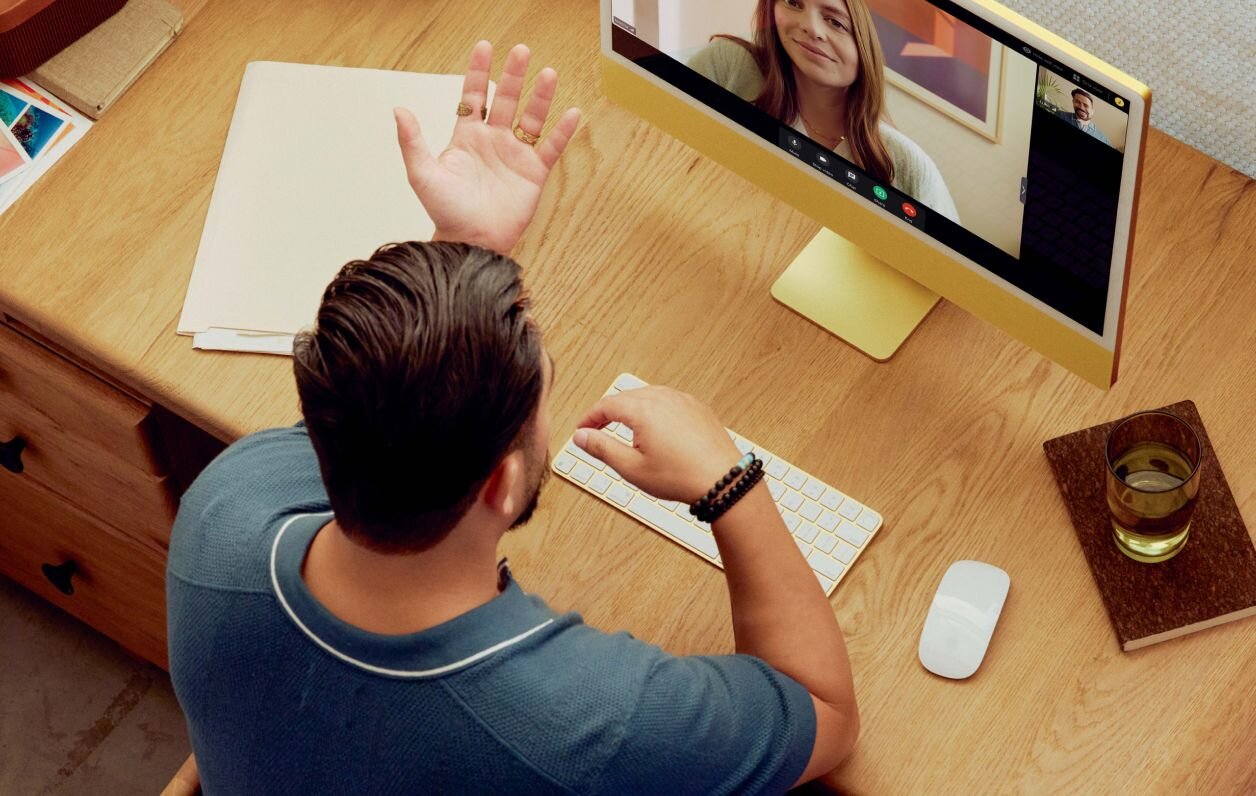 Speech-language pathologist talking with client on computer