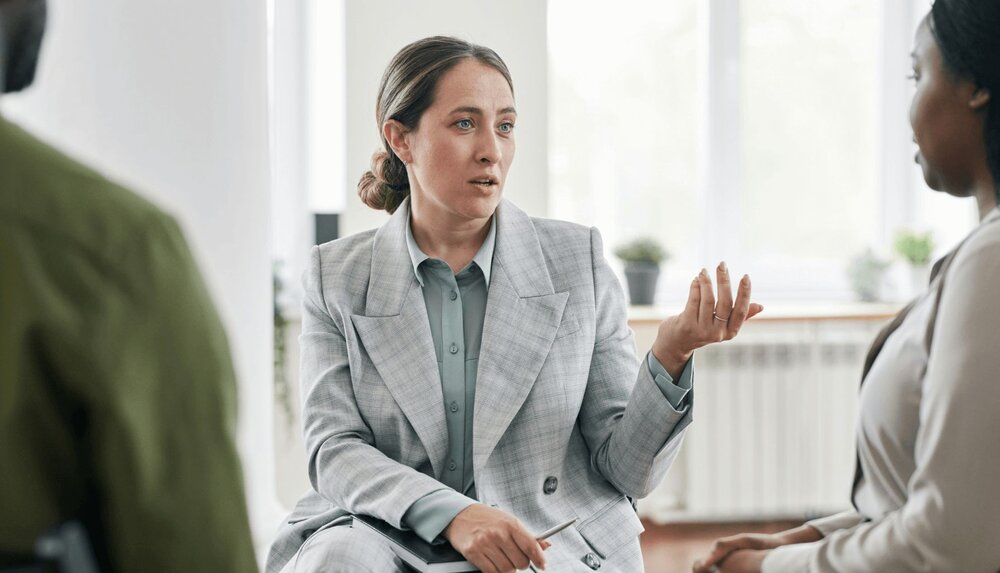 therapist teaching client active listening skills using the active listening worksheet