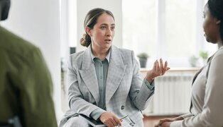 therapist teaching client active listening skills using the active listening worksheet
