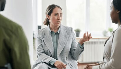 therapist teaching client active listening skills using the active listening worksheet