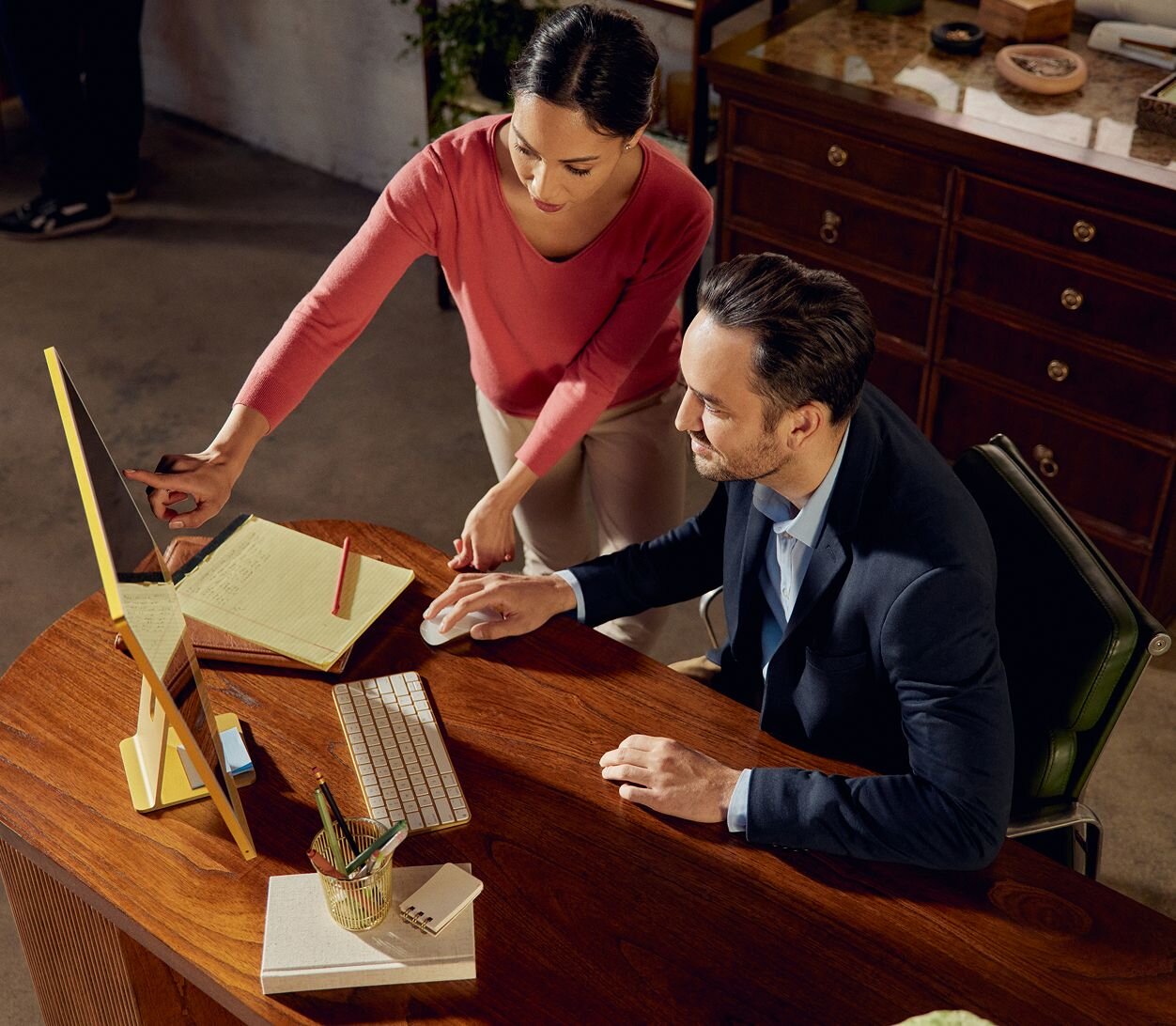 Practitioners working together on desktop computer
