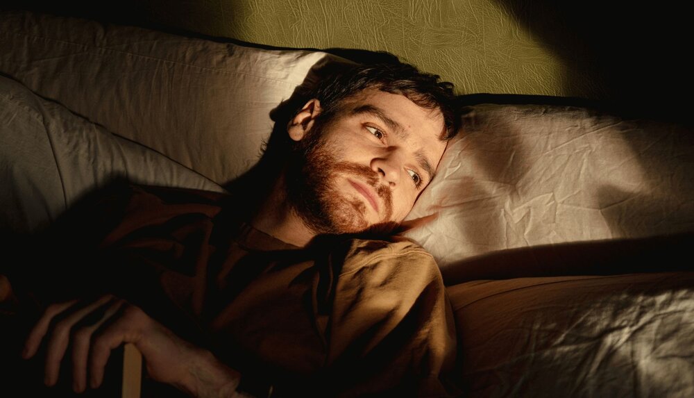 person in bed after learning exposure therapy psychoeducation in therapy
