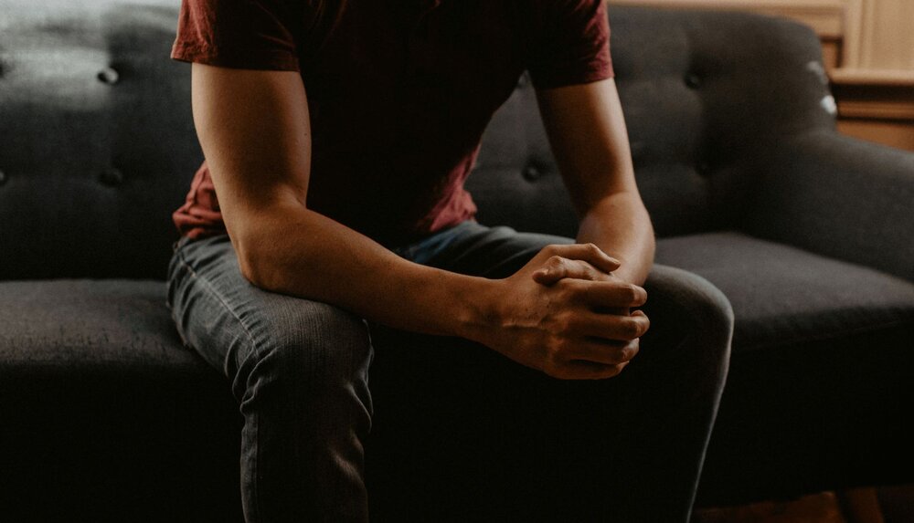 close up person looking for icd-10 code for alcohol use disorder