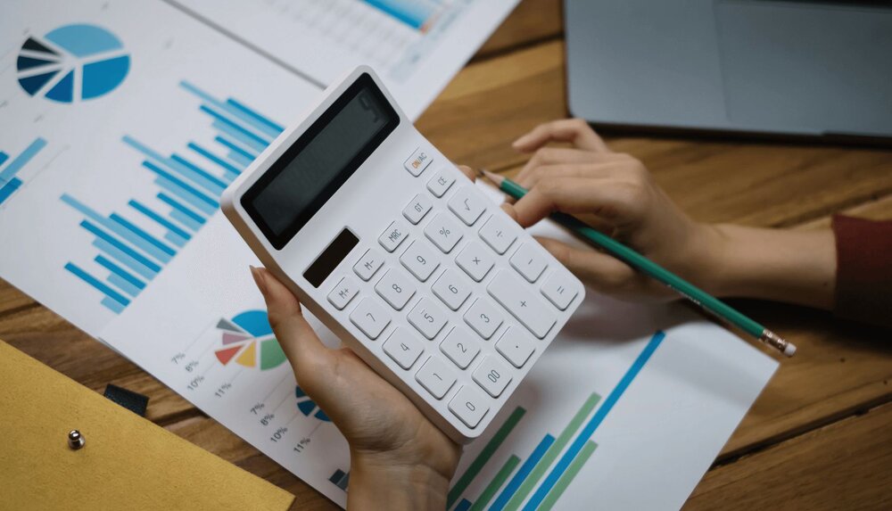 person using calculator and making decisions using cost-benefit analysis therapy