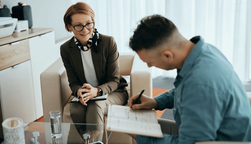 A therapists goes over AI informed consent with a client