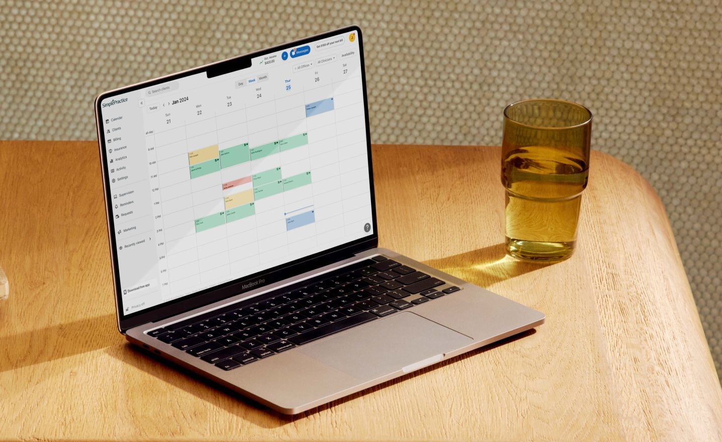 Computer displaying EHR calendar on desk