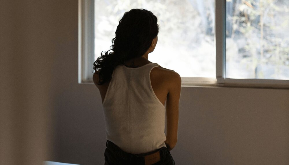 person looking out a window