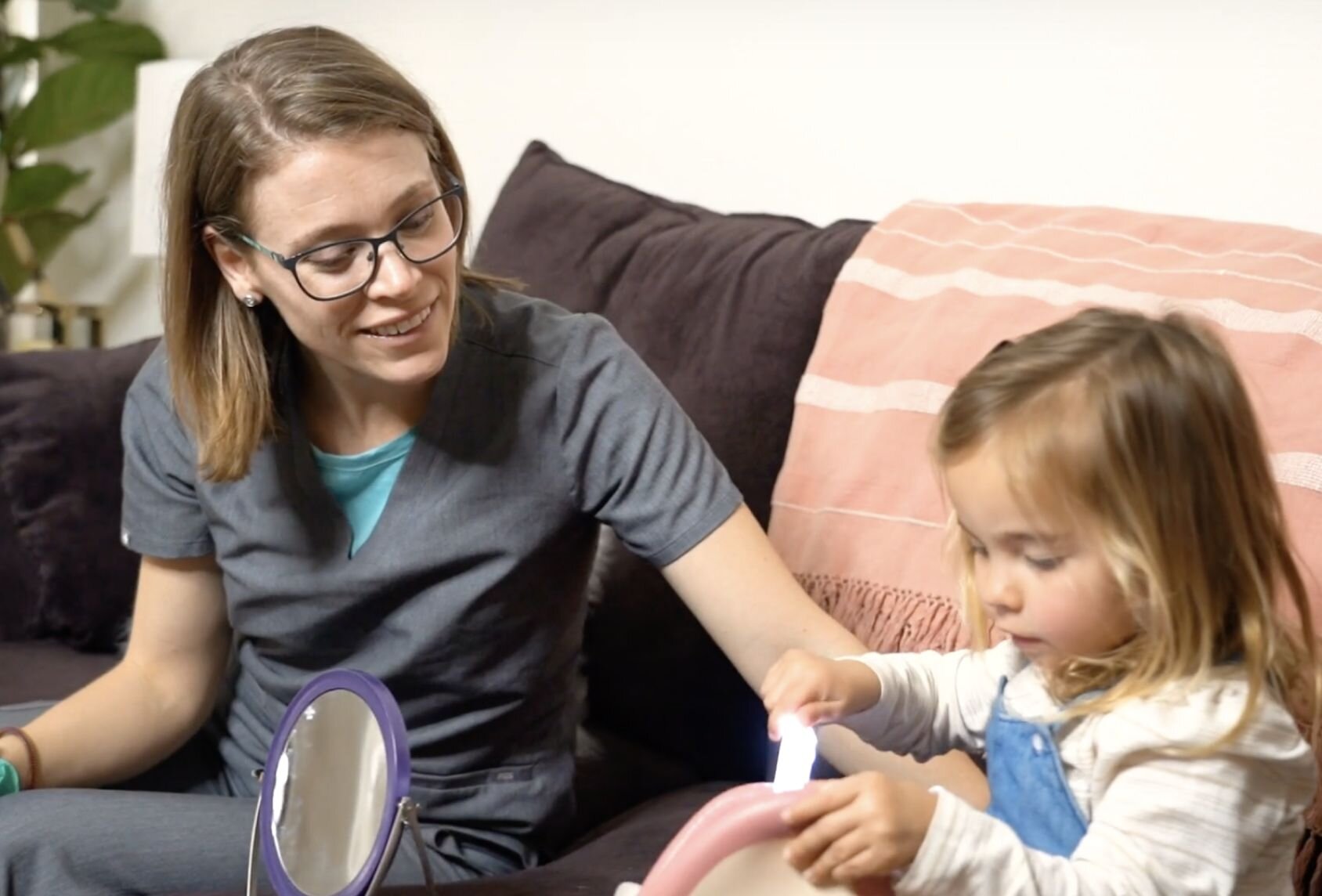 Speech-language pathologist Jill Shook working with child