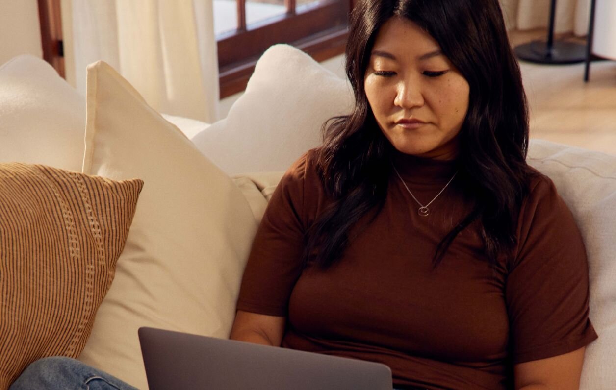 Psychiatrist creating documentation on laptop