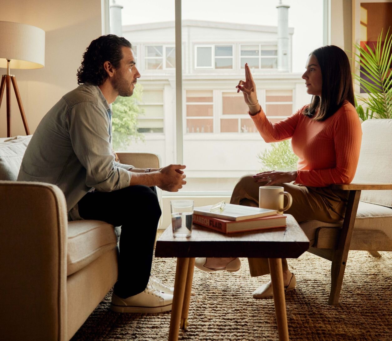 Occupational therapist working with client on couch