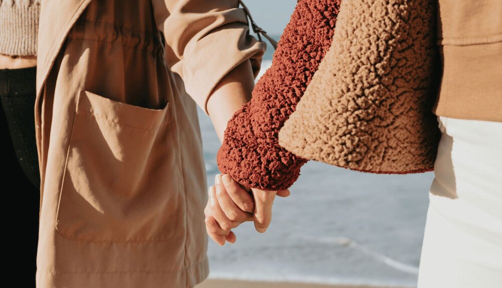 people holding hands showing they used identifying your needs in a relationship worksheet 