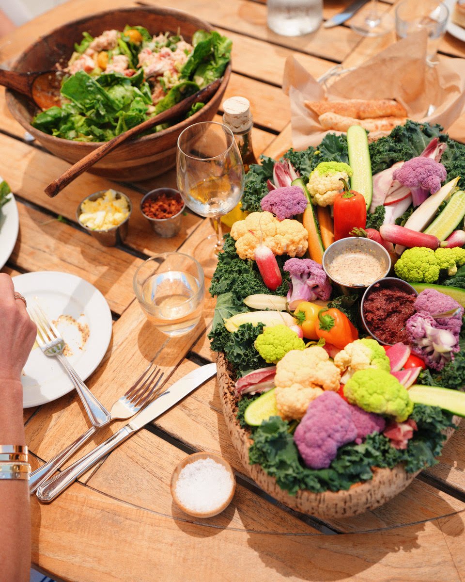 Large crudites platter alongside the lobster cobb salad as guests dine at the table