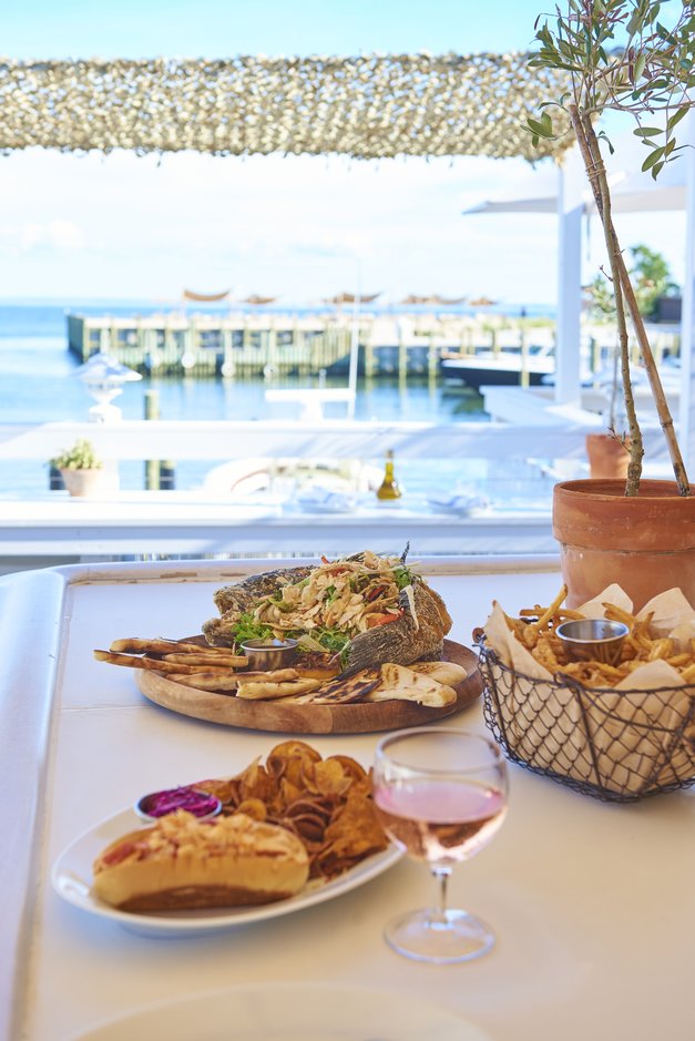 The lobster roll and Mediterranean spreads set out at the bar at Duryea's Orient Point