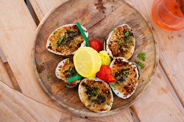Baked Clam platter placed on wooden table