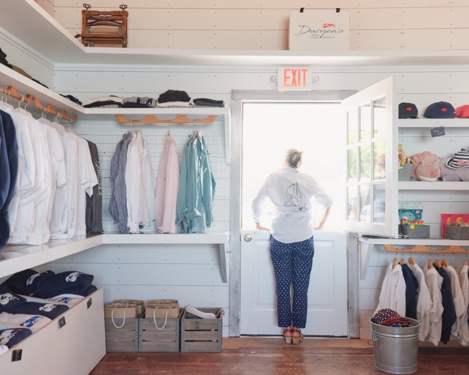 Manager looking out of the boutique door at Duryea's Boutique