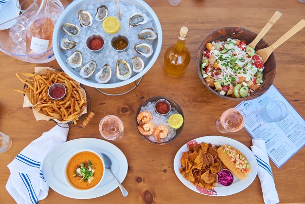 Selection of different plates with shrimp cocktail, melon salad, gazpacho and oysters at Duryea's Orient Point