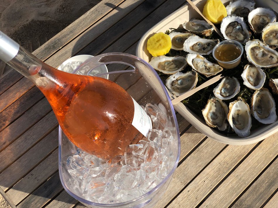 Bottle of Duryea's Private Label Rose with a platter of oysters at Duryea's Orient Point