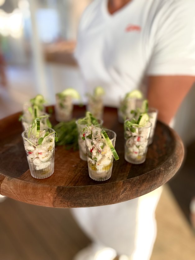 Canapes served on a wooden tray at a private event