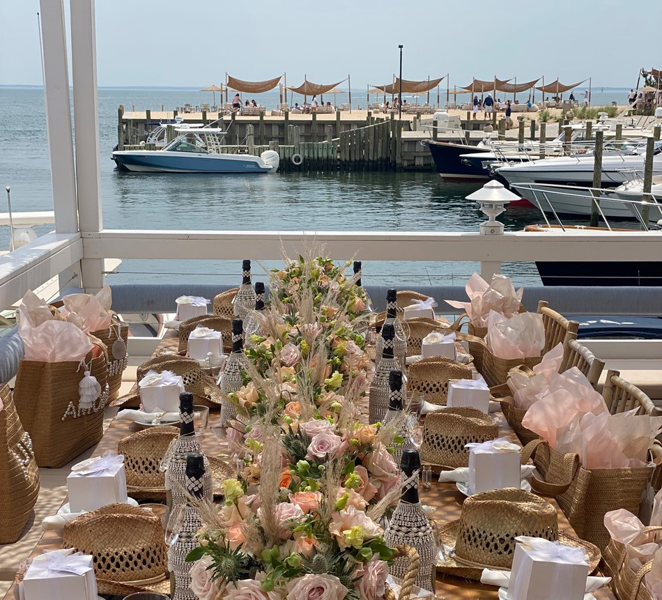 A Prix Fixe Luncheon with floral arrangements and party favors set up at Duryea's Orient Point