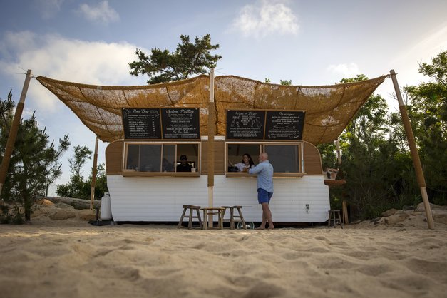 The Beach Club Food Truck with customer at the order window