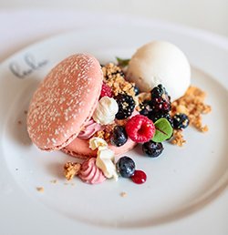 Macaron and fresh berries dessert featured at Lulu