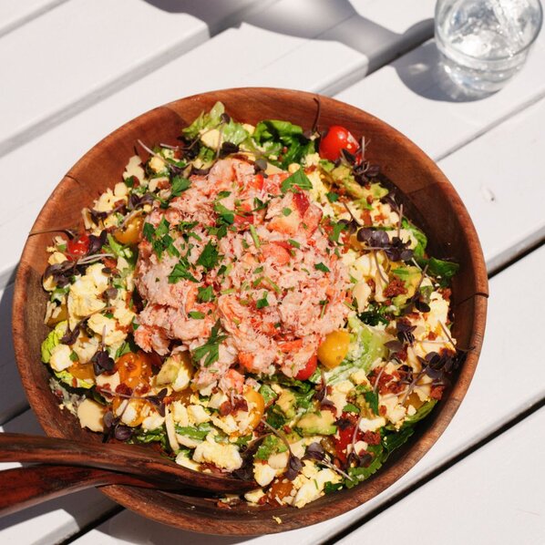 Famous Lobster Cobb Salad with Tarragon Dressing alongside the Duryea's Lobster Roll