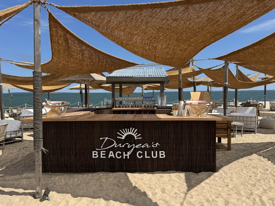 Entrance to the beach Club at Duryea's Orient Point with sand and boardwalk